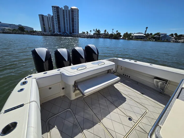  Yacht Photos Pics HCB 42 Siesta 2018 boat with four engines on calm water.