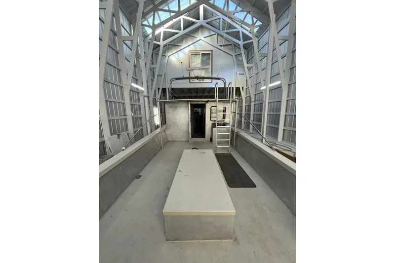  Yacht Photos Pics Interior of a 1990 custom rebuilt dive boat, featuring spacious deck and modern design.