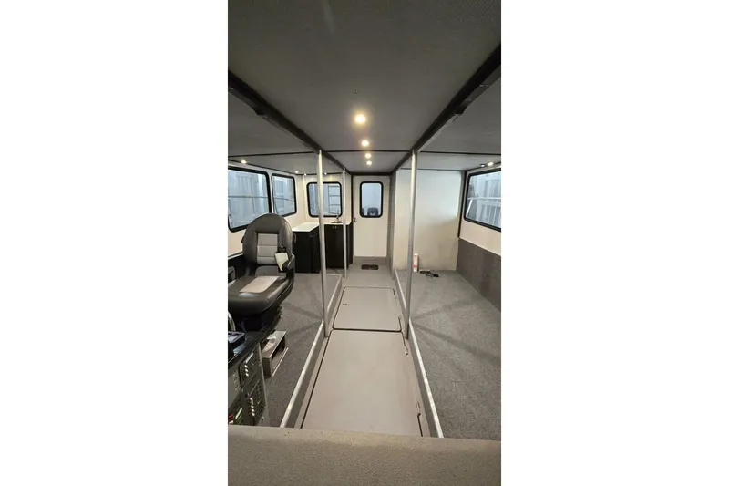  Yacht Photos Pics Interior of a 1990 custom rebuilt dive boat, featuring modern seating and spacious layout.