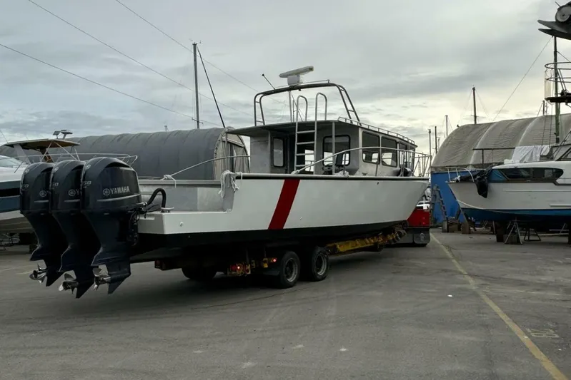  Yacht Photos Pics Custom rebuilt dive boat from 1990 on trailer, featuring Yamaha outboard motors.