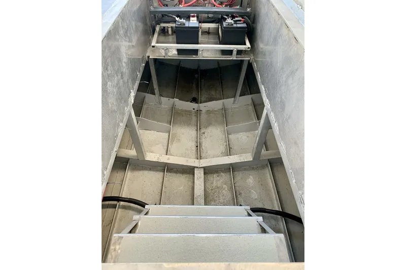  Yacht Photos Pics Interior view of a 1990 custom rebuilt dive boat, showcasing structural framework and battery setup.
