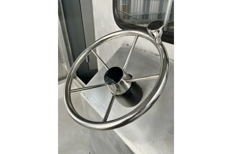  Yacht Photos Pics Stainless steel steering wheel on 1990 custom rebuilt dive boat.