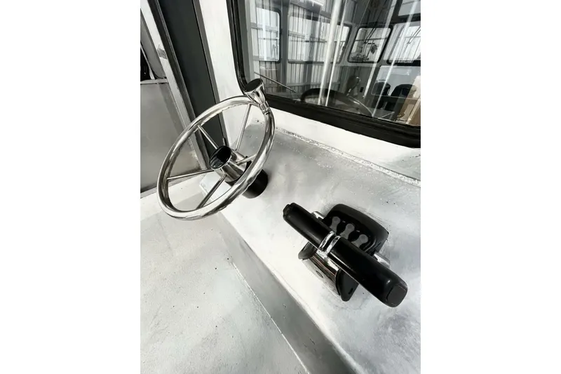  Yacht Photos Pics Steering wheel and controls of a 1990 custom rebuilt dive boat, offshore model.