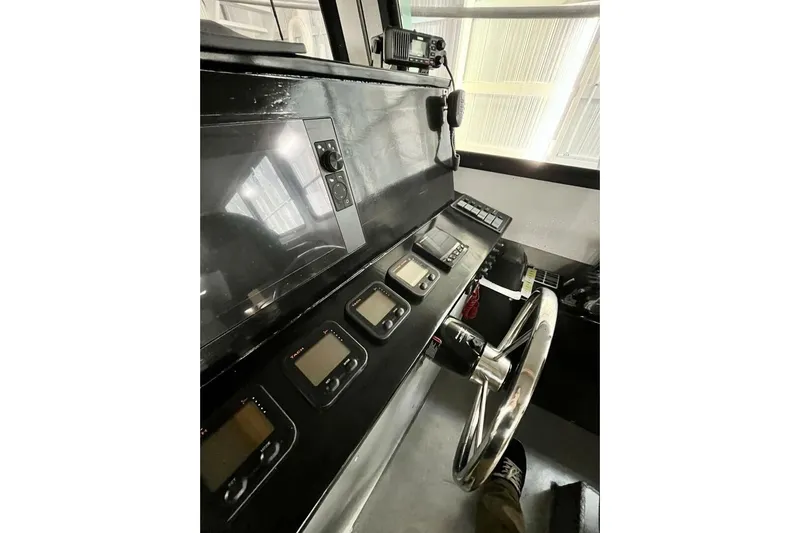  Yacht Photos Pics Control panel of a 1990 custom rebuilt dive boat with modern navigation equipment.