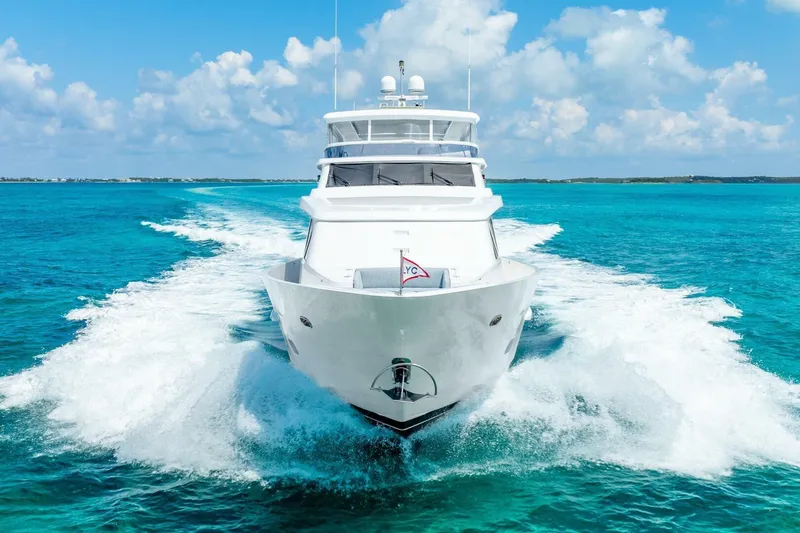 Done Deal Yacht Photos Pics Luxury 2010 Hargrave Raised Pilothouse yacht cruising in clear blue ocean waters.