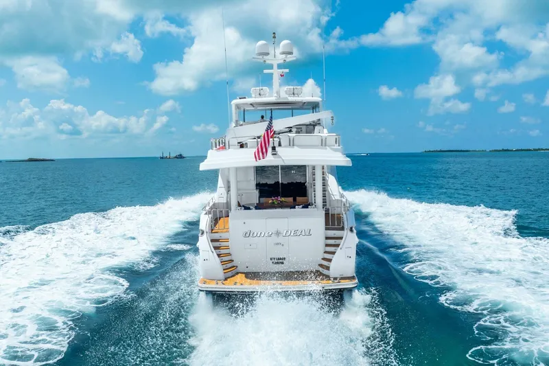 Done Deal Yacht Photos Pics 2010 Hargrave Raised Pilothouse yacht cruising on open sea under blue skies.