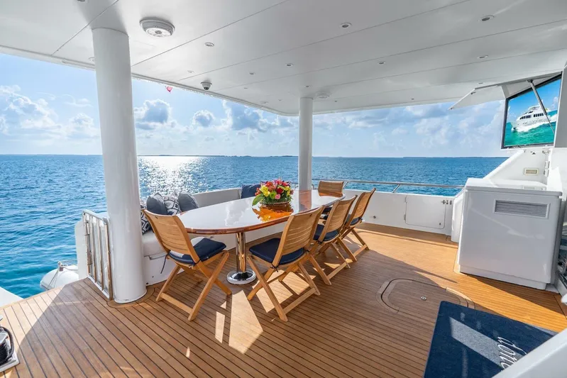 Done Deal Yacht Photos Pics Luxurious 2010 Hargrave Raised Pilothouse yacht deck with ocean view and elegant dining setup.