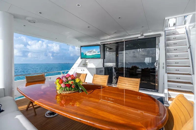 Done Deal Yacht Photos Pics Luxurious 2010 Hargrave Raised Pilothouse yacht deck with ocean view and elegant dining area.