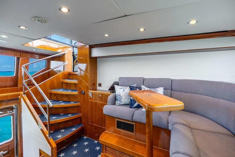Done Deal Yacht Photos Pics Luxurious 2010 Hargrave Raised Pilothouse interior with elegant staircase and cozy seating area.