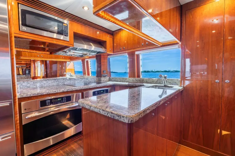 Done Deal Yacht Photos Pics Luxurious kitchen interior of 2010 Hargrave Raised Pilothouse yacht with ocean view.