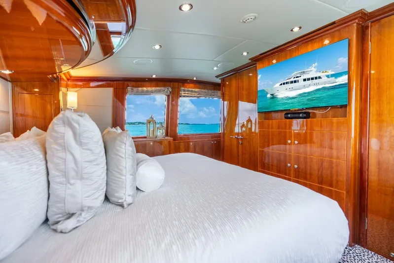 Done Deal Yacht Photos Pics Luxurious 2010 Hargrave Raised Pilothouse yacht bedroom with ocean view and elegant wood finishes.