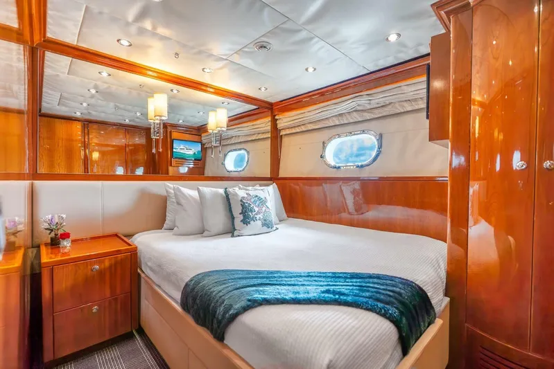 Done Deal Yacht Photos Pics Luxurious 2010 Hargrave Raised Pilothouse yacht bedroom with elegant wood finishes.
