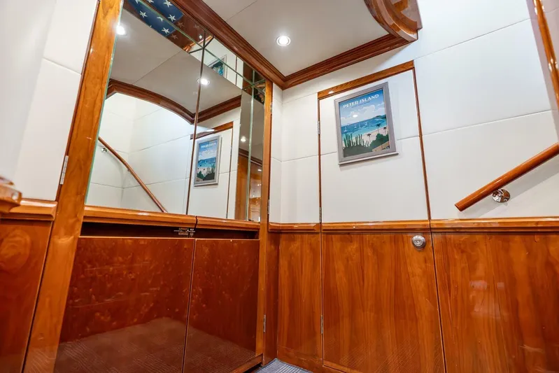 Done Deal Yacht Photos Pics Luxurious interior of 2010 Hargrave Raised Pilothouse yacht with wood paneling and framed artwork.