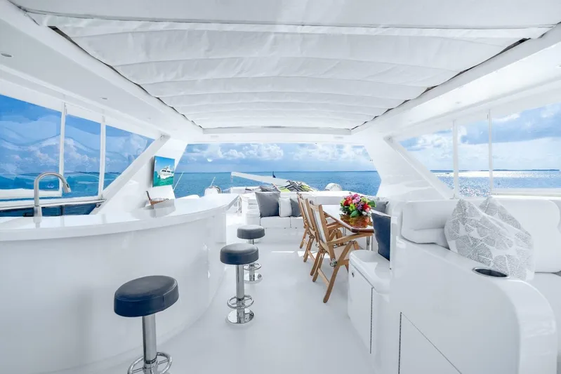 Done Deal Yacht Photos Pics Luxurious 2010 Hargrave Raised Pilothouse yacht interior with ocean view, bar, and seating area.