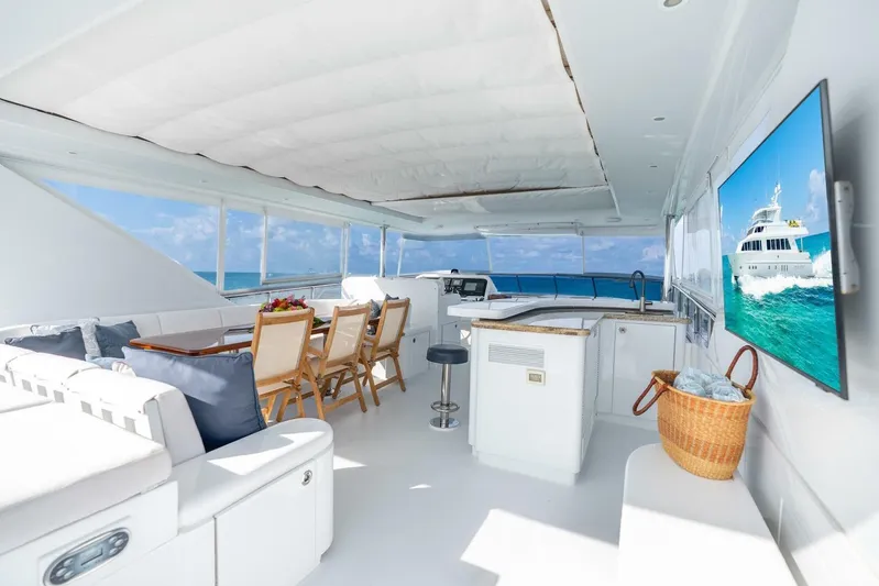Done Deal Yacht Photos Pics Luxurious 2010 Hargrave Raised Pilothouse yacht interior with seating, dining area, and ocean view.