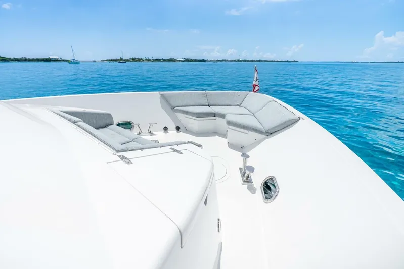 Done Deal Yacht Photos Pics Luxurious 2010 Hargrave Raised Pilothouse yacht with spacious deck seating on clear blue waters.