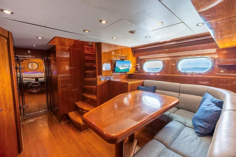 Done Deal Yacht Photos Pics Luxurious 2010 Hargrave Raised Pilothouse yacht interior with elegant wood finishes and plush seating.