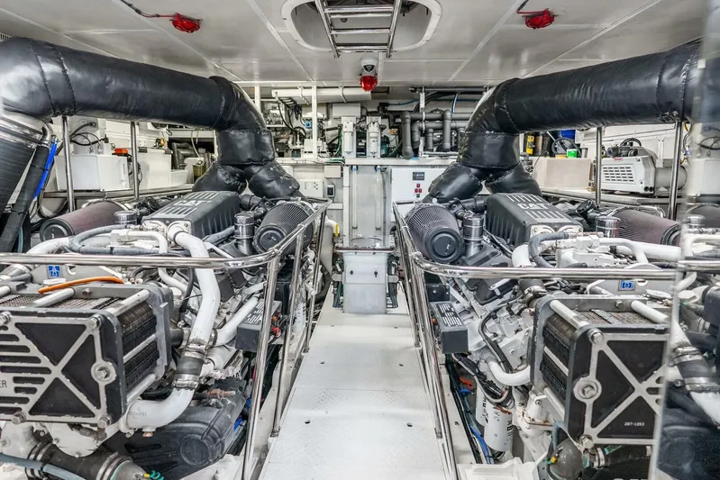 Done Deal Yacht Photos Pics Engine room of 2010 Hargrave Raised Pilothouse yacht, featuring dual Caterpillar engines.
