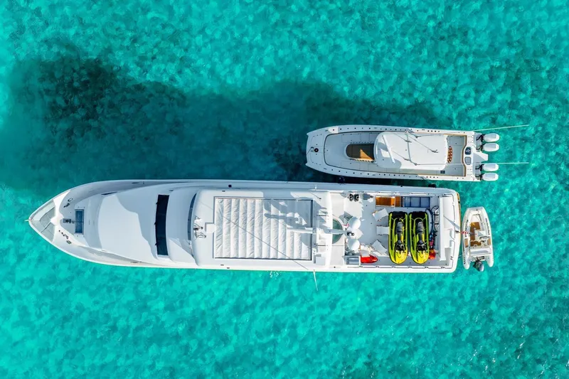 Done Deal Yacht Photos Pics Aerial view of 2010 Hargrave Raised Pilothouse yacht on clear turquoise water.