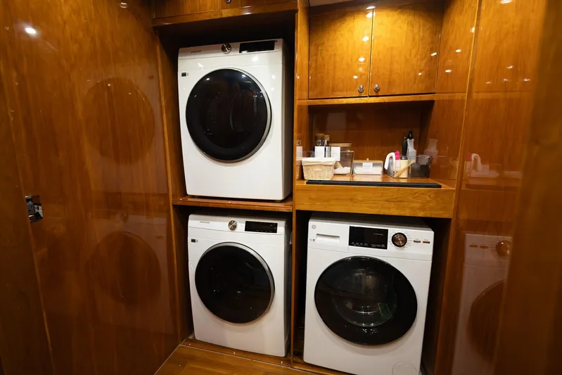 Done Deal Yacht Photos Pics Laundry area in 2010 Hargrave Raised Pilothouse yacht with modern appliances and wooden cabinetry.