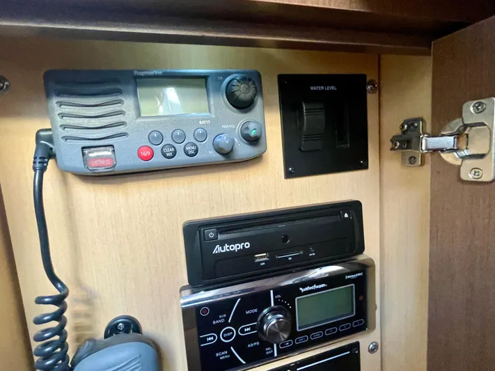 Ilaria Yacht Photos Pics Control panel inside 2014 Sea Ray 330 Sundancer boat, featuring radio and electronic equipment.