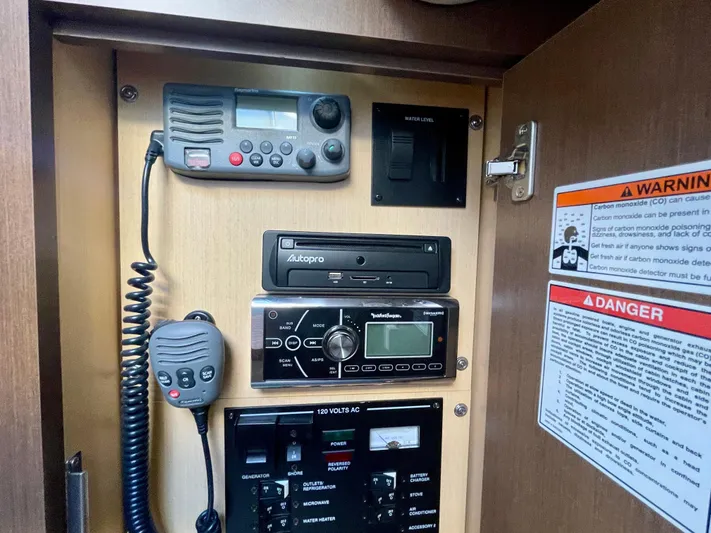 Ilaria Yacht Photos Pics Control panel of 2014 Sea Ray 330 Sundancer with radio and warning labels.