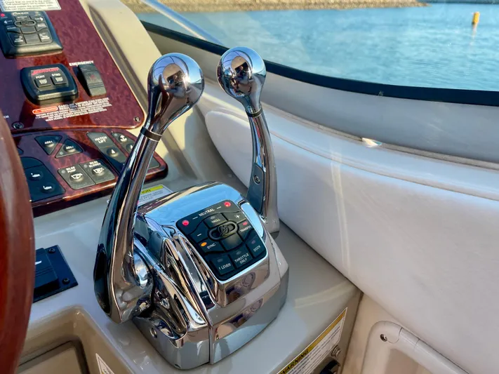 Ilaria Yacht Photos Pics Chrome throttle controls on 2014 Sea Ray 330 Sundancer boat dashboard.