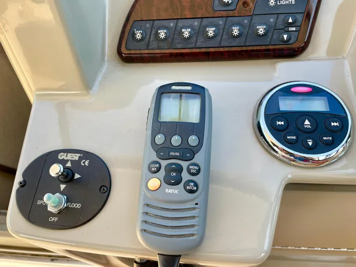 Ilaria Yacht Photos Pics Control panel of a 2014 Sea Ray 330 Sundancer boat with various switches and devices.