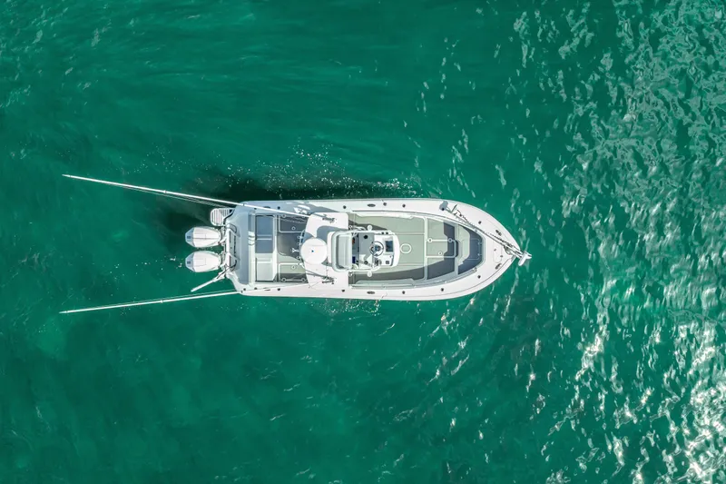  Yacht Photos Pics Aerial view of 2021 Yellowfin 26 Hybrid boat on turquoise water.