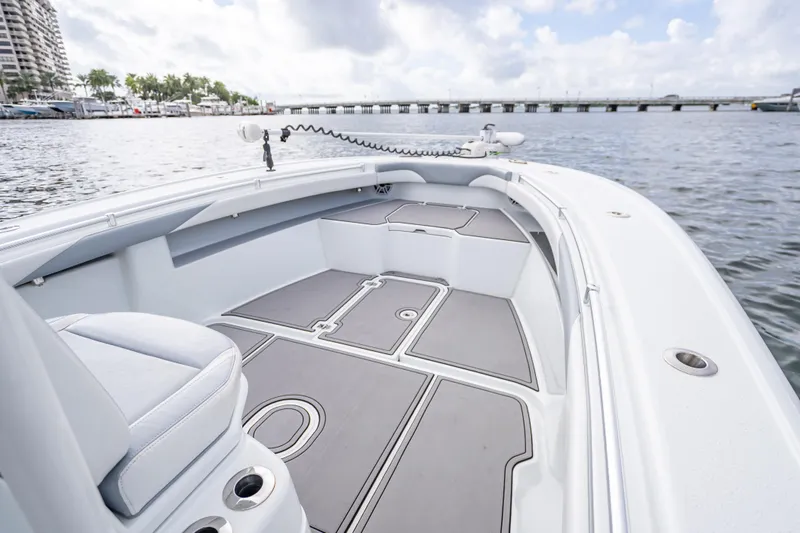  Yacht Photos Pics 2021 Yellowfin 26 Hybrid boat interior with sleek design on calm water.