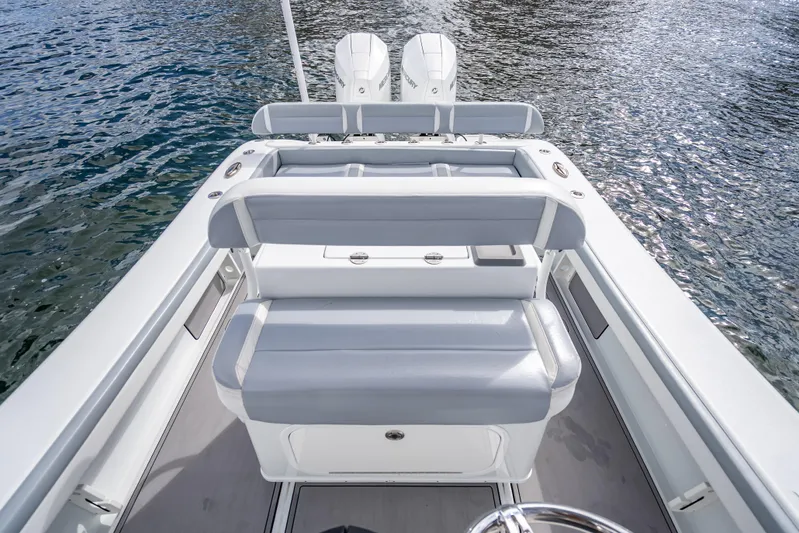  Yacht Photos Pics 2021 Yellowfin 26 Hybrid boat interior with dual engines on water.