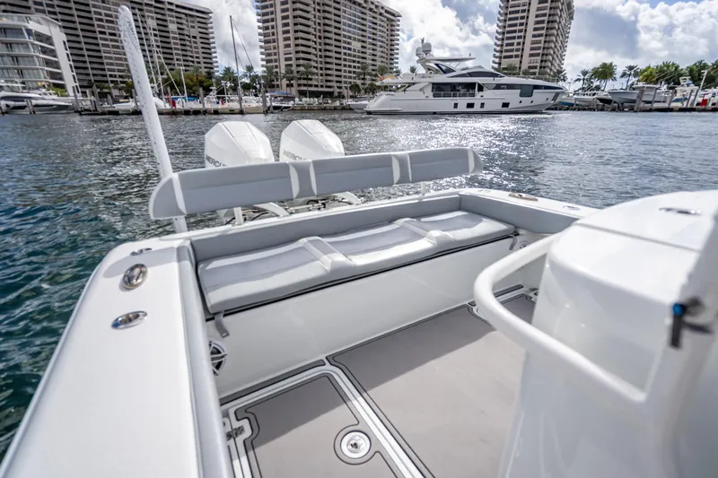 Yacht Photos Pics 2021 Yellowfin 26 Hybrid boat interior with marina view, featuring dual Mercury engines.