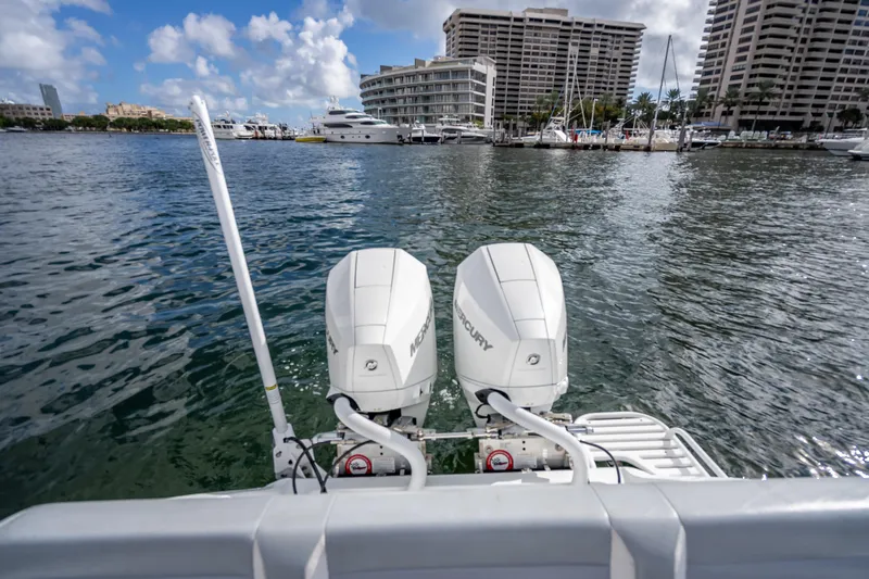  Yacht Photos Pics 2021 Yellowfin 26 Hybrid boat with dual Mercury outboard engines in a marina setting.