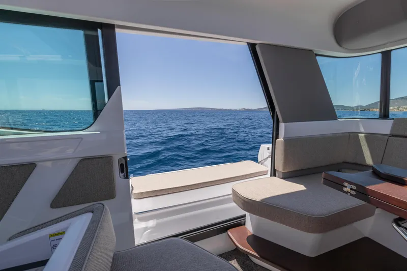  Yacht Photos Pics Interior view of 2023 Axopar 45 Cross Cabine with ocean backdrop.