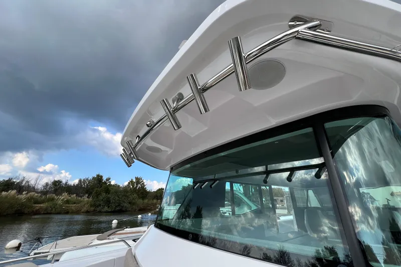  Yacht Photos Pics 2023 Axopar 45 Cross Cabine boat with sleek design and stainless steel railings.