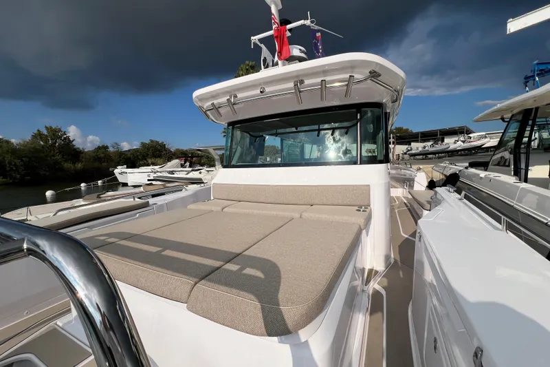  Yacht Photos Pics 2023 Axopar 45 Cross Cabin boat with spacious deck and modern design.