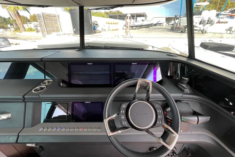  Yacht Photos Pics 2023 Axopar 45 Cross Cabine helm with modern controls and navigation displays.