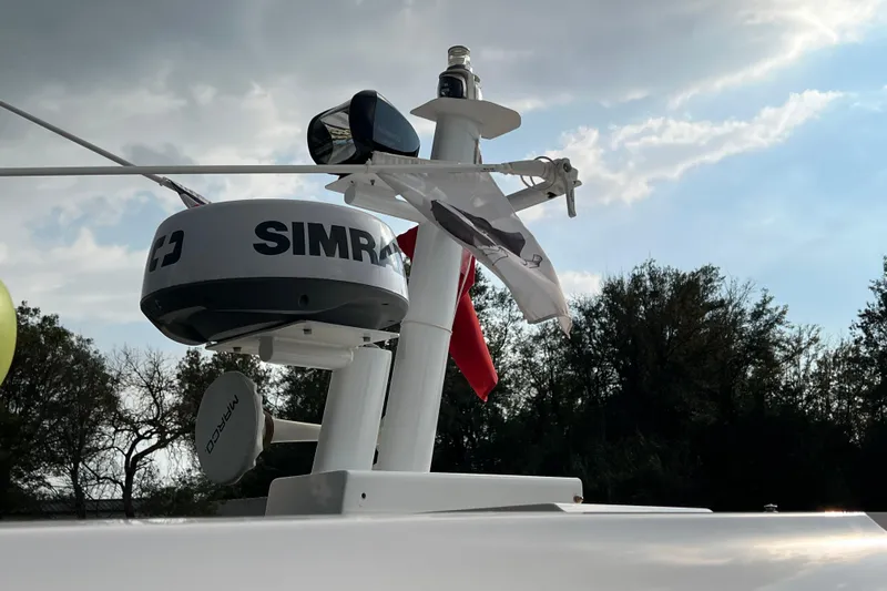  Yacht Photos Pics Radar and equipment on 2023 Axopar 45 Cross Cabine boat under cloudy sky.