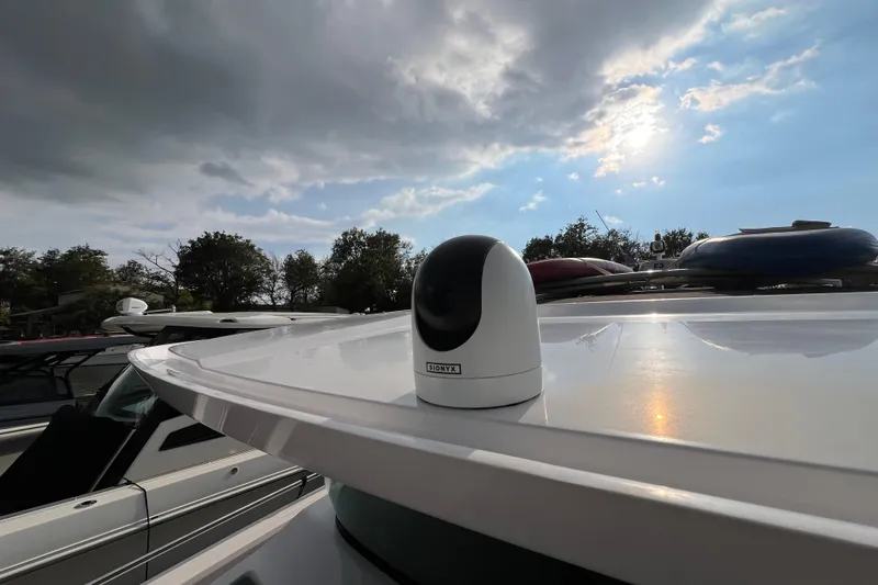  Yacht Photos Pics 2023 Axopar 45 Cross Cabine with Onyx camera under cloudy sky.