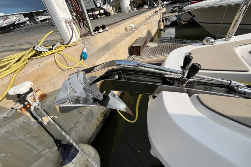  Yacht Photos Pics 2023 Axopar 45 Cross Cabine boat anchor detail at marina dock.