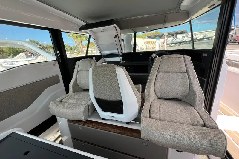  Yacht Photos Pics 2023 Axopar 45 Cross Cabin interior with modern seating and sleek design.