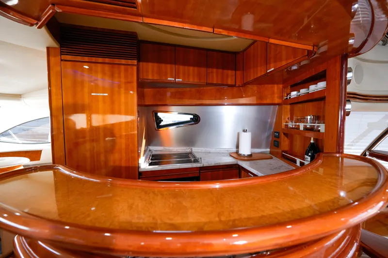 Finesse Yacht Photos Pics Luxurious wooden kitchen interior of 2007 Azimut 68E yacht.
