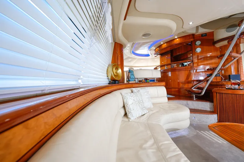 Finesse Yacht Photos Pics Luxurious interior of a 2007 Azimut 68E yacht with elegant wood finishes and plush seating.