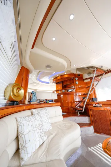 Finesse Yacht Photos Pics Luxurious interior of a 2007 Azimut 68E yacht with elegant wood finishes and plush seating.