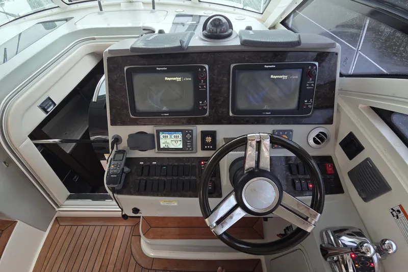  Yacht Photos Pics 2012 Sea Ray 470 Sundancer helm with dual Raymarine displays and modern controls.