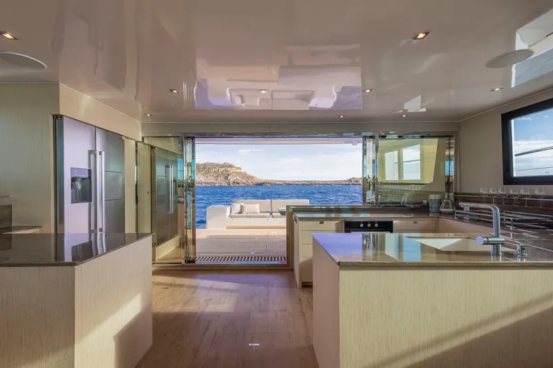  Yacht Photos Pics Modern kitchen interior on Silent 60 yacht, 2025 model, with ocean view.