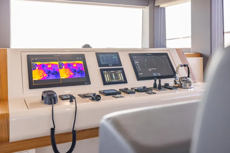 Yacht Photos Pics Control panel of Silent 60 yacht, 2025 model, featuring advanced navigation and thermal imaging screens.