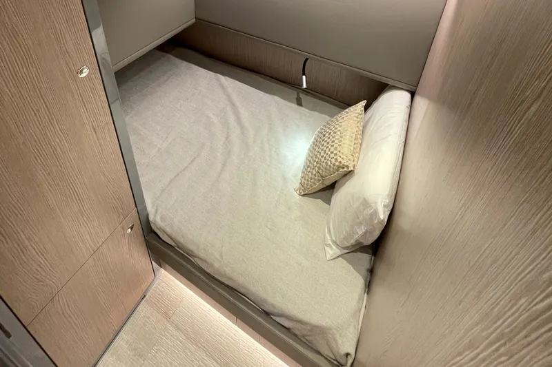  Yacht Photos Pics 2023 Canados 431 GLADIATOR cabin with a cozy bed and modern wooden interior.