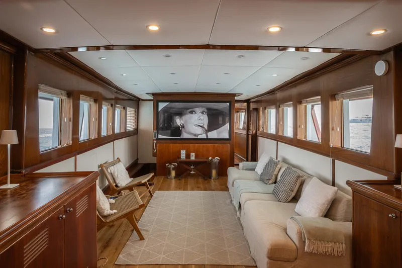 Black Pepper Yacht Photos Pics Luxurious 1975 Lavagna motoryacht interior with elegant wood paneling and comfortable seating.