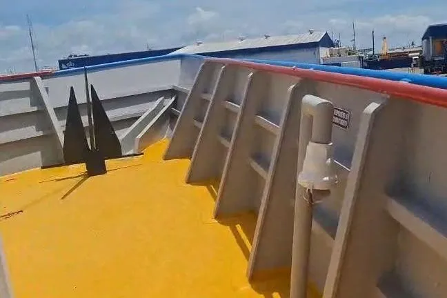  Yacht Photos Pics Custom built offshore crew vessel deck, 2009 model, with vibrant yellow flooring and industrial design.